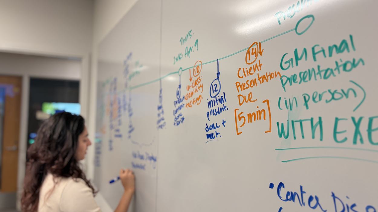 Dhruvi writing on whiteboard