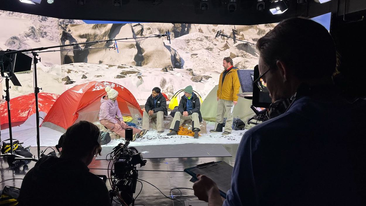 Cast members perform one of the Mount Everest simulation scenes on the center's XR Stage during filming for the Leadership for Healthcare Professionals series.